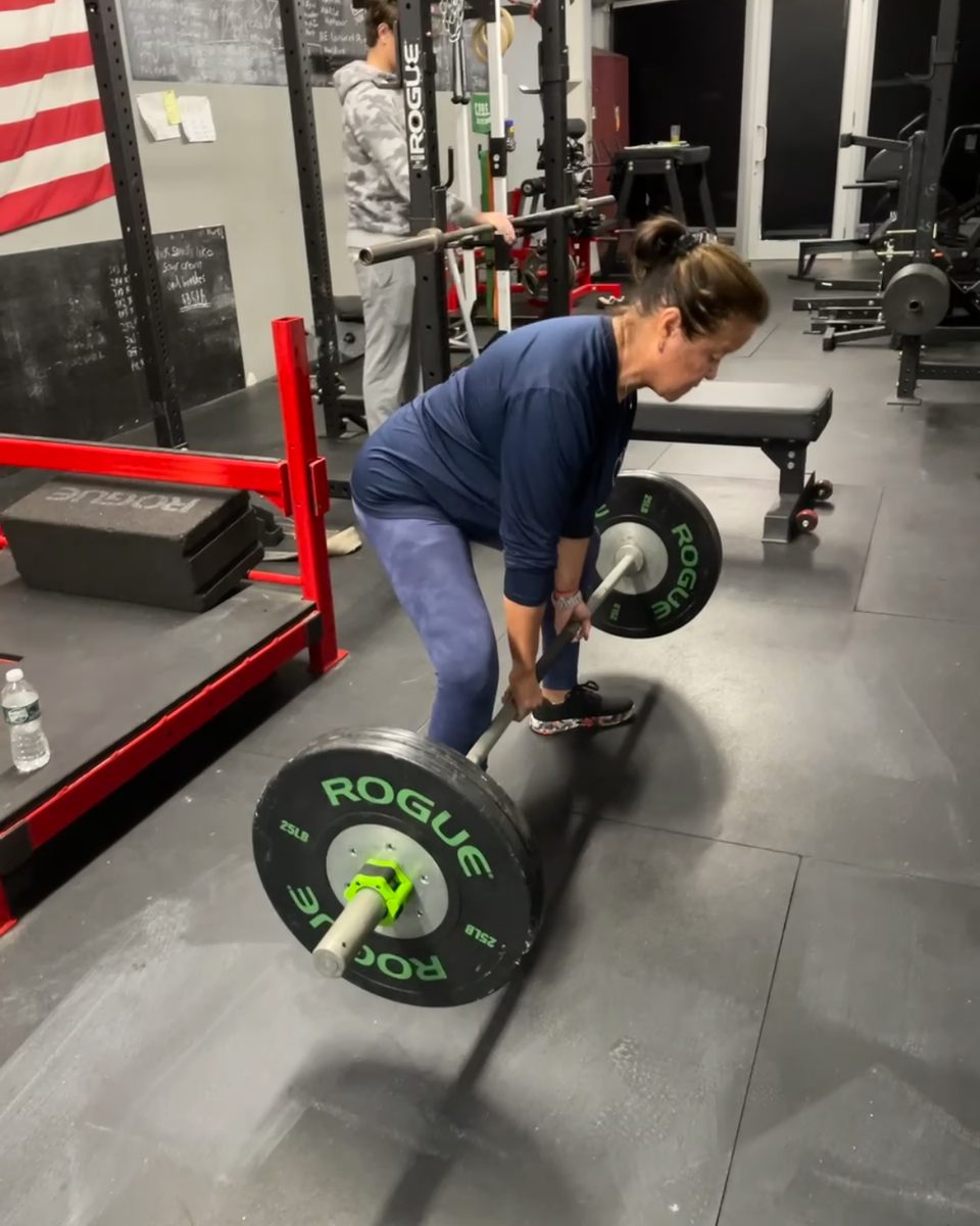 Older woman deadlifting at Atlas Strength