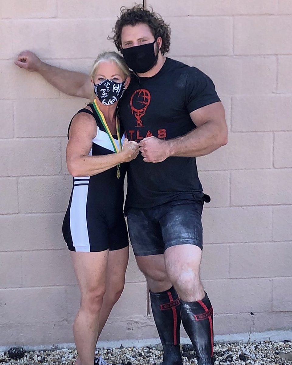 Atlas Strength lifter with her powerlifting medal and Patrick Rice
