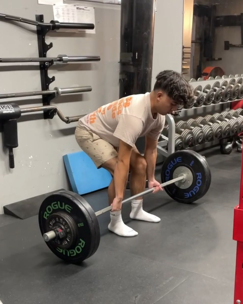 Teen setting up for a deadlift at Atlas Strength
