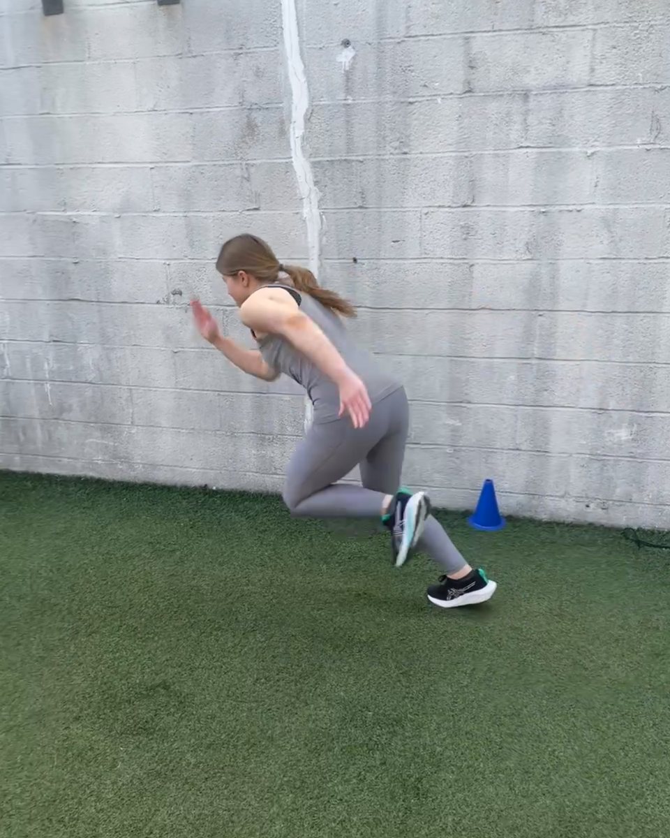 Client exploding out of a sprint start on the turf at Atlas Strength