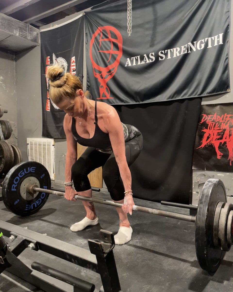 Woman deadlifting at Atlas Strength in Carle Place
