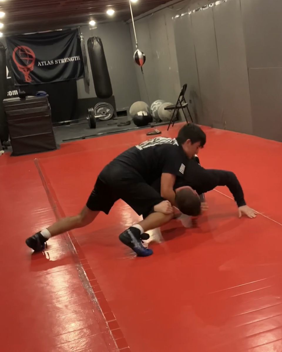 Wrestlers drilling on the mats at Atlas Strength